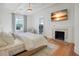 Large bedroom with fireplace, hardwood floors and a view at 320 29Th Nw St, Bradenton, FL 34205