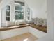 Cozy window seat with comfortable pillows, perfect for relaxing at 320 29Th Nw St, Bradenton, FL 34205