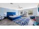 Large main bedroom with a plush blue bed and plenty of natural light at 4371 Balsey St, North Port, FL 34286