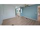 Blue bedroom with laminate flooring and access to bathroom at 4531 13Th E St, Ellenton, FL 34222