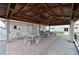 Relaxing community patio with tables, chairs, and ceiling fan at 4531 13Th E St, Ellenton, FL 34222