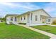 Tan single story home with a covered porch, and well maintained lawn at 4531 13Th E St, Ellenton, FL 34222