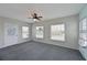 Spacious Gathering room with ceiling fan and grey carpeting at 4531 13Th E St, Ellenton, FL 34222