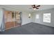 Bright Gathering room with sliding glass doors and grey carpeting at 4531 13Th E St, Ellenton, FL 34222