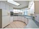 Modern kitchen featuring white cabinets and a light blue countertop at 4531 13Th E St, Ellenton, FL 34222