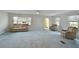 Spacious living room with light blue carpet and neutral walls at 4531 13Th E St, Ellenton, FL 34222