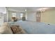 Open living room with light walls and blue carpeting at 4531 13Th E St, Ellenton, FL 34222