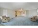 Spacious living room with light blue carpet and recliner chairs at 4531 13Th E St, Ellenton, FL 34222