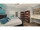 Bedroom with full-size bed, built-in shelving, and workspace at 4651 Claremont Park Dr, Bradenton, FL 34211