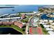 Aerial view of waterfront community with pool and tennis courts at 4726 Independence Dr # 4726, Bradenton, FL 34210