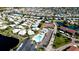 Aerial view showcasing community pool, tennis courts, and surrounding buildings at 4726 Independence Dr # 4726, Bradenton, FL 34210