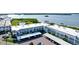 Aerial view of waterfront community with pool and tennis courts at 4726 Independence Dr # 4726, Bradenton, FL 34210