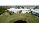 Aerial view highlighting building location near pond at 4726 Independence Dr # 4726, Bradenton, FL 34210