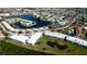 Aerial view of condo community, highlighting building location, pool, and tennis courts at 4726 Independence Dr # 4726, Bradenton, FL 34210