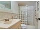 Clean bathroom with a glass block shower and built-in shelving at 4726 Independence Dr # 4726, Bradenton, FL 34210
