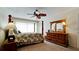 Bedroom featuring a wooden post bed and ample closet space at 4726 Independence Dr # 4726, Bradenton, FL 34210