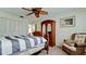 Bedroom with a wooden bed frame, wardrobe, and seating area at 4726 Independence Dr # 4726, Bradenton, FL 34210