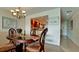Bright dining room features a wood table and chairs, and views into the kitchen at 4726 Independence Dr # 4726, Bradenton, FL 34210