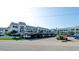 Exterior view of condo building with parking at 4726 Independence Dr # 4726, Bradenton, FL 34210