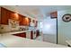 Kitchen with wood cabinets, tiled backsplash and modern appliances at 4726 Independence Dr # 4726, Bradenton, FL 34210