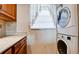 Stackable washer and dryer in a well-lit laundry area at 4726 Independence Dr # 4726, Bradenton, FL 34210