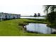 Scenic waterfront view with pond and lush greenery at 4726 Independence Dr # 4726, Bradenton, FL 34210
