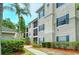 Apartment building with green shutters and landscaping at 5160 Northridge Rd # 107, Sarasota, FL 34238