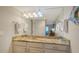Bathroom with granite countertop and double sink vanity at 5311 Gulf Of Mexico Dr # 3, Longboat Key, FL 34228