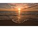 Stunning sunset over a tranquil ocean beach at 5311 Gulf Of Mexico Dr # 3, Longboat Key, FL 34228