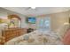 Primary bedroom with king-size bed and private access to balcony at 5311 Gulf Of Mexico Dr # 3, Longboat Key, FL 34228