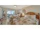 Guest bedroom with two twin beds, dresser, and ocean views at 5311 Gulf Of Mexico Dr # 3, Longboat Key, FL 34228