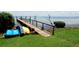 Private wooden dock with kayaks and access to the water at 5311 Gulf Of Mexico Dr # 3, Longboat Key, FL 34228