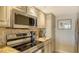 Stainless steel appliances and granite countertops in kitchen at 5311 Gulf Of Mexico Dr # 3, Longboat Key, FL 34228