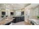 Elegant bathroom with granite countertops, a soaking tub and shower at 5401 Oak Grove Ct, Sarasota, FL 34233