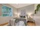 Guest bedroom with a bed, window, and wood floors at 5401 Oak Grove Ct, Sarasota, FL 34233