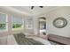 Main bedroom with king-size bed and backyard access at 5401 Oak Grove Ct, Sarasota, FL 34233