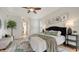 Main bedroom with king-size bed, and access to the bathroom at 5401 Oak Grove Ct, Sarasota, FL 34233