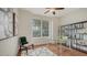 Home office with hardwood floors, large window, and built-in shelving at 5401 Oak Grove Ct, Sarasota, FL 34233