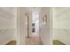 Large walk-in closet with ample shelving and leads to the bathroom at 5401 Oak Grove Ct, Sarasota, FL 34233