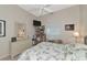 Bright bedroom with a floral bedspread and mirrored dresser at 5650 Country Walk Ln, Sarasota, FL 34233