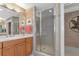Bathroom with double sinks and a large shower at 615 Riviera Dunes Way # 104, Palmetto, FL 34221