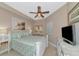 Spacious bedroom with a comfortable bed and a flat-screen TV at 615 Riviera Dunes Way # 104, Palmetto, FL 34221