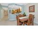 Casual dining area with wooden table and chairs near the kitchen at 615 Riviera Dunes Way # 104, Palmetto, FL 34221