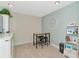 Home office with desk, chairs, and built-in shelving at 615 Riviera Dunes Way # 104, Palmetto, FL 34221