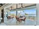 Covered balcony with outdoor seating and stunning water views at 635 Key Royale Dr, Holmes Beach, FL 34217