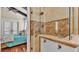 Walk-in shower with tile surround and glass enclosure at 635 Key Royale Dr, Holmes Beach, FL 34217