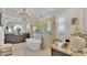 Elegant bathroom features a soaking tub, double vanity, and a large walk-in shower at 635 Key Royale Dr, Holmes Beach, FL 34217