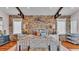 Bedroom with stone wall and hardwood floors at 635 Key Royale Dr, Holmes Beach, FL 34217