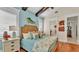 Main bedroom with light blue walls and coastal decor at 635 Key Royale Dr, Holmes Beach, FL 34217