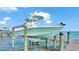 Covered boat lift providing protection for your boat at 635 Key Royale Dr, Holmes Beach, FL 34217